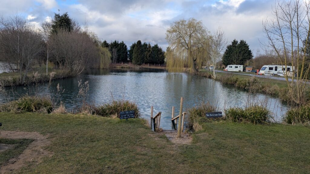 Horseshoe Lake at Pool Bridge Farm near York, one of four wild swimming lakes on site at the campsite